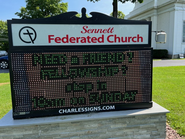 Sign that says Sennett Federated Church Need a Friendly Fellowship?  Stop in 10am on Sunday charlessigns.com